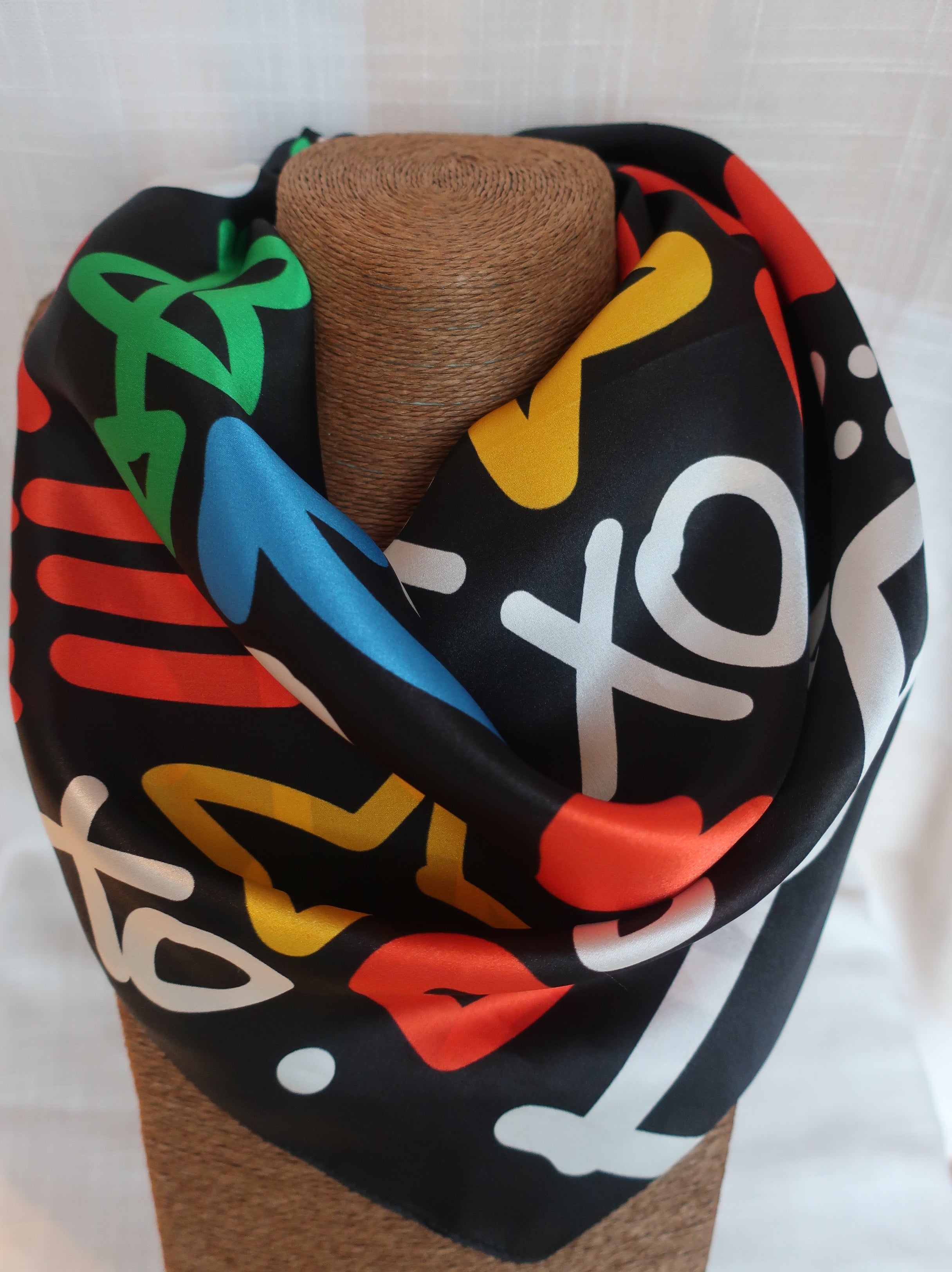 Colorful patterned bandanna on a white background