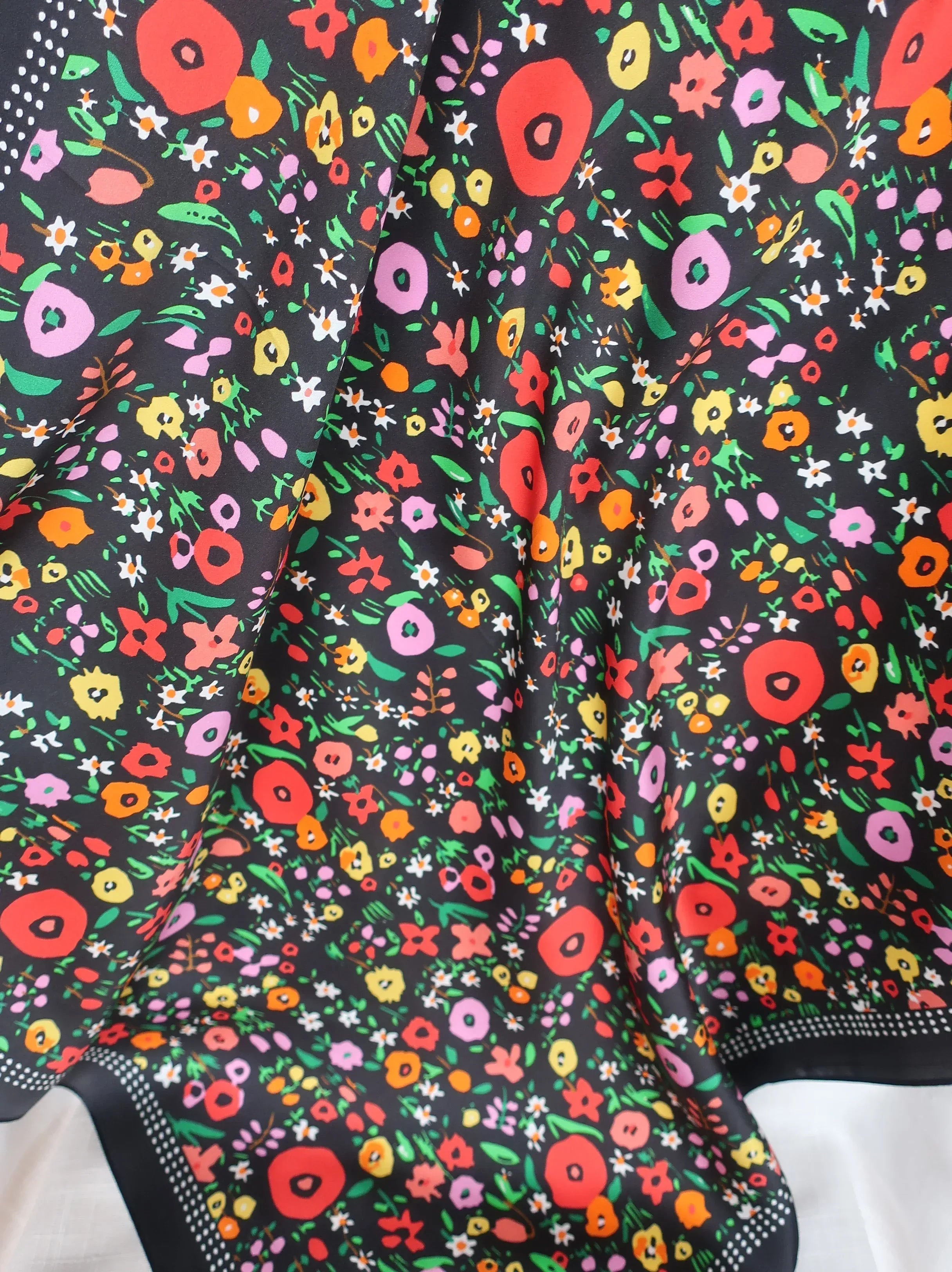 Close-up of a colorful floral pattern on a black background