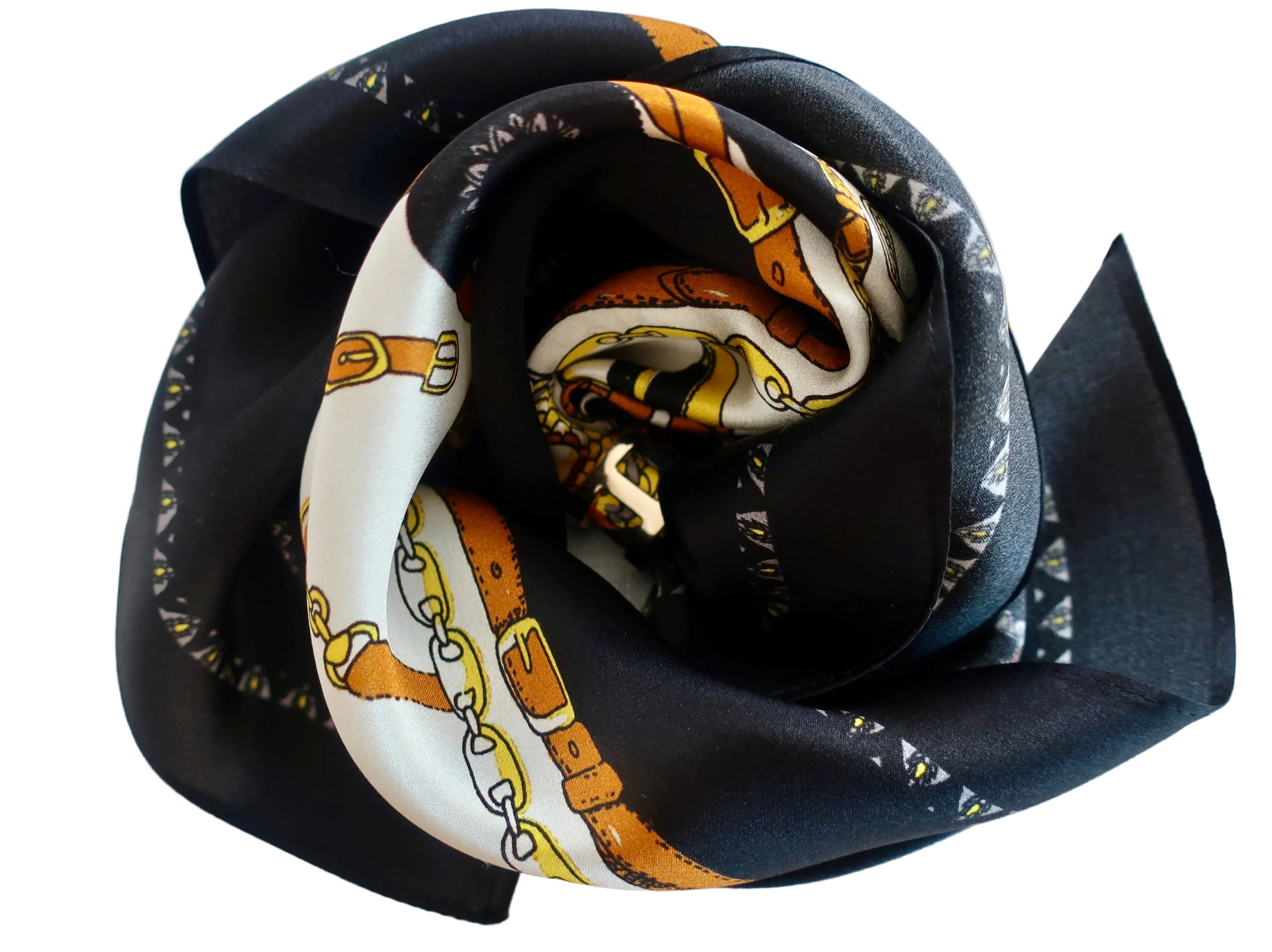 Black fabric flower with a patterned center on a light gray background