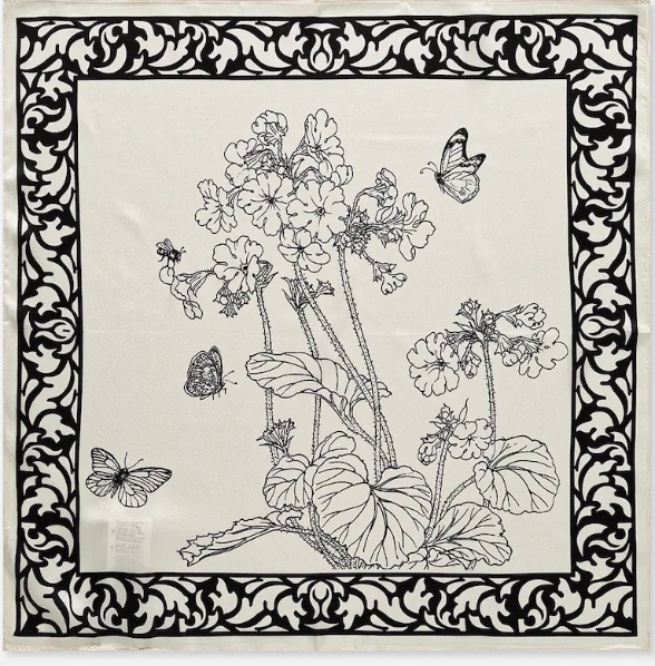 Decorative scarf with black floral and butterfly design on a white background