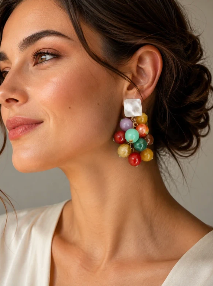 Model wearing colorful stone cluster earrings