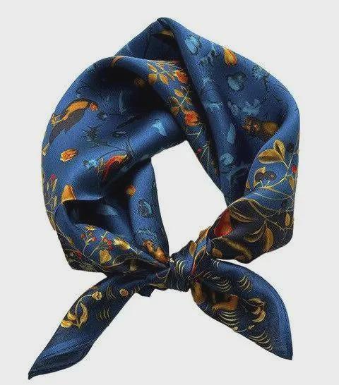 Blue floral patterned headscarf on a light gray background