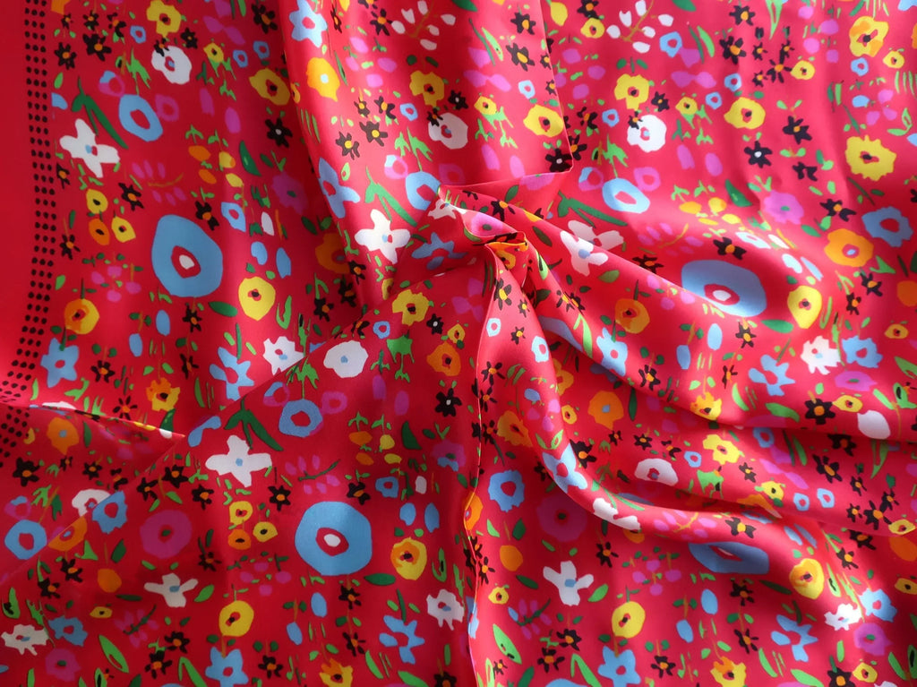 Vibrant red mulberry silk square scarf with colorful floral pattern in pink, blue, yellow and white blooms on bright red background - Scarves4you