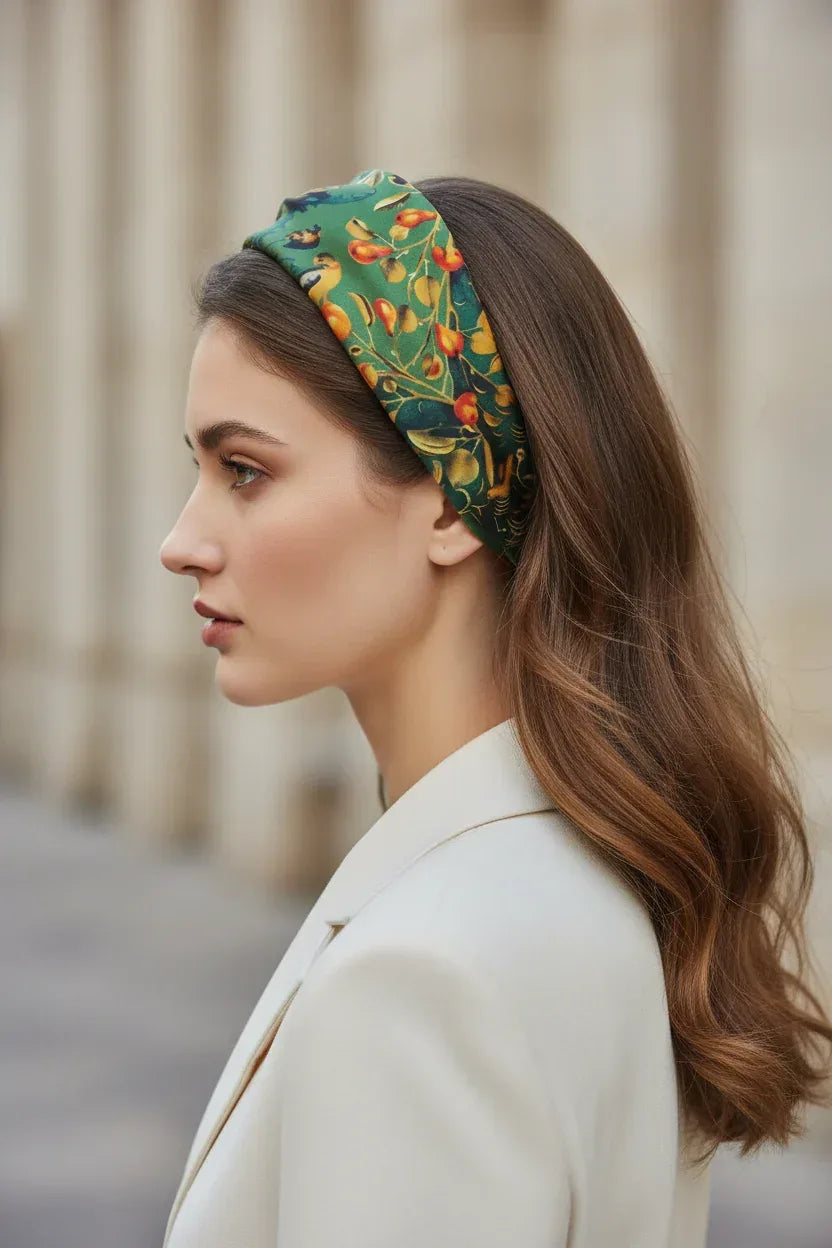 Woman wearing a colorful headband with a blurred background